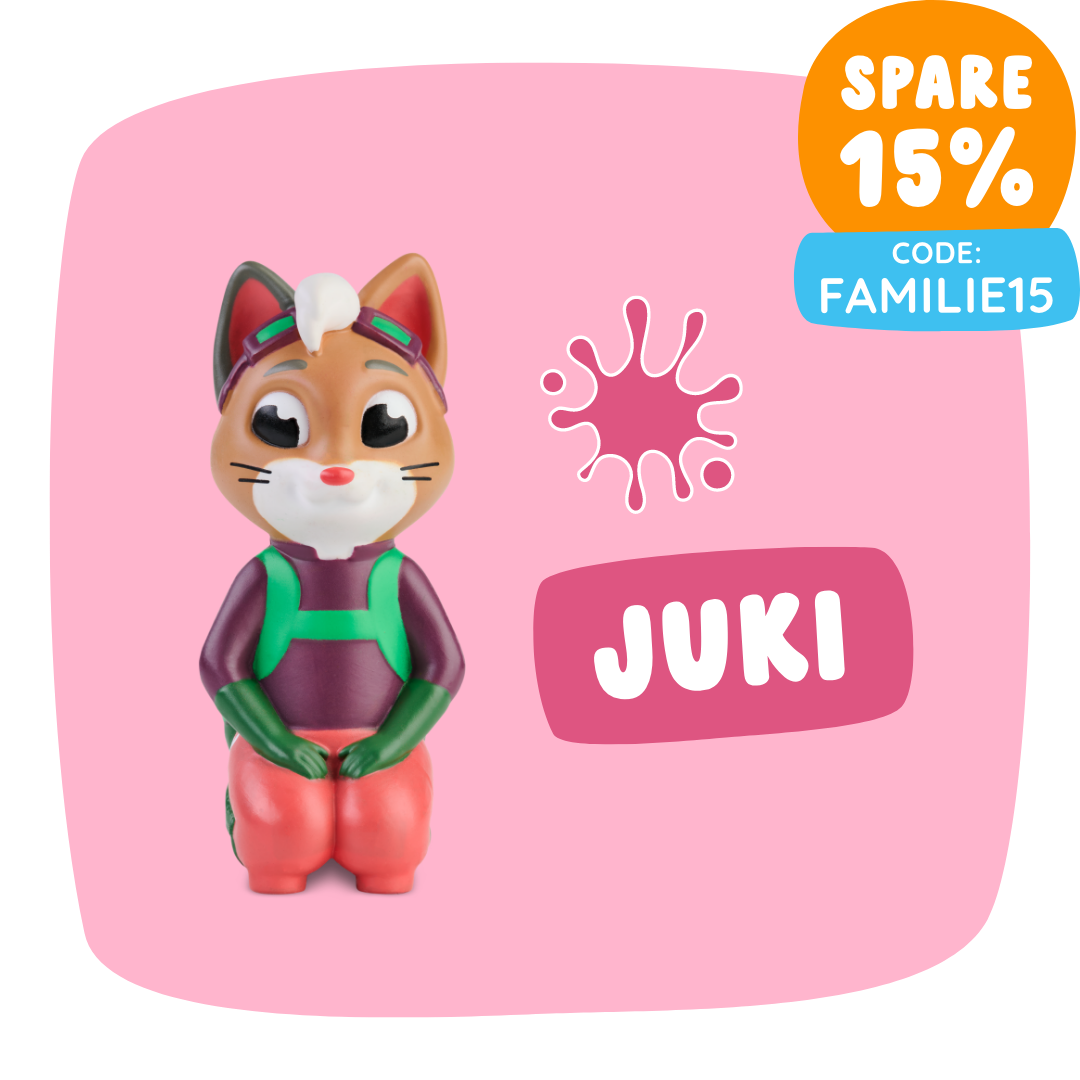 Spielzeugfuchsfigur namens Juki sitzt auf einem rosa Hintergrund mit einem 15 % Rabattcode: FAMILIE15.