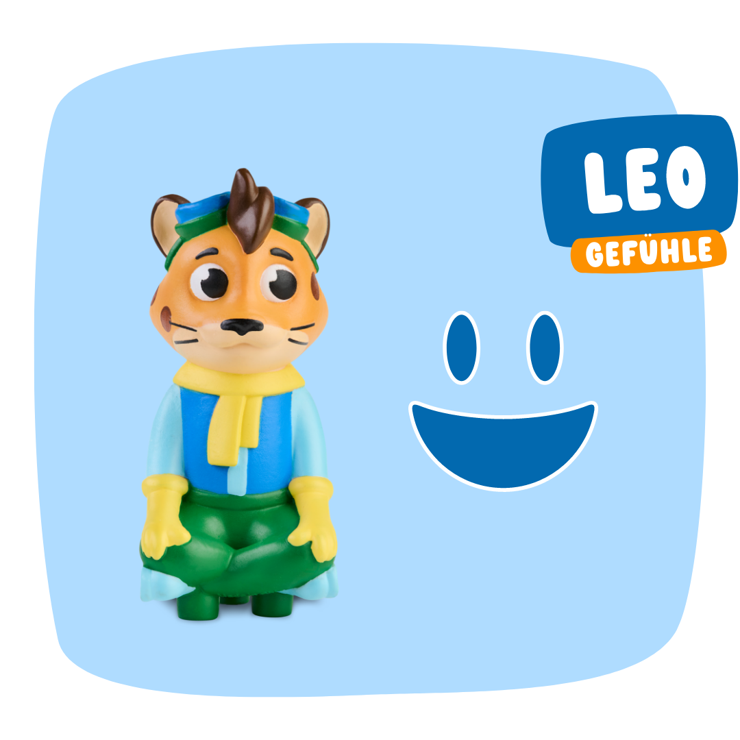 Die Leo "Meine Gefühle" Spielzeug-Tigerfigur von Edurino DE trägt blaue und grüne Kleidung, hat den Text LEO GEFÜHLE, ein blaues Smiley-Gesicht und betont soziale Stärke & Empathie auf blauem Hintergrund.
